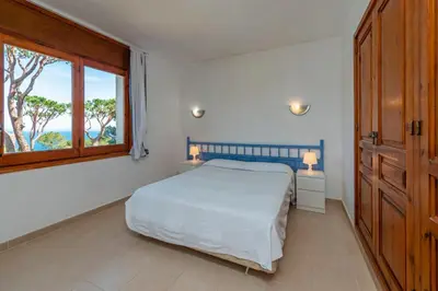 Cama o camas de una habitación en E-2 CALELLA DE PALAFRUGELL 8 PAX