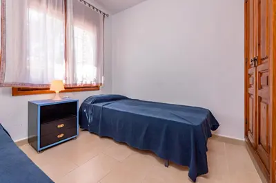 Cama o camas de una habitación en E-2 CALELLA DE PALAFRUGELL 8 PAX