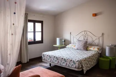 Cama o camas de una habitación en L'ARGOLLA HOTEL-Pizzeria