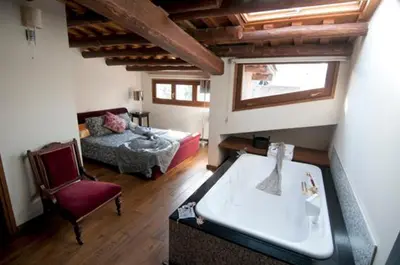 Cama o camas de una habitación en L'ARGOLLA HOTEL-Pizzeria