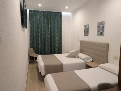 Cama o camas de una habitación en Hotel Mitus