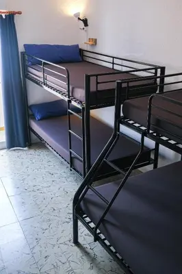 Cama o camas de una habitación en Mana Mana Youth Hostel