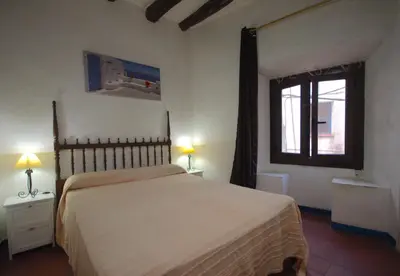 Cama o camas de una habitación en Lets Holidays APARTMENT IN THE OLD TOWN TOSSA