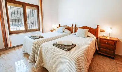 Cama o camas de una habitación en Cal Nano (Casa Rural)