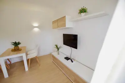 Una televisión o centro de entretenimiento en V&V LLORET- Apartamento Europa