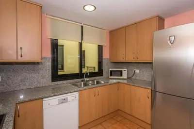 Una cocina o zona de cocina en HomeHolidaysRentals Escapade