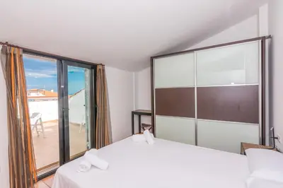 Cama o camas de una habitación en HomeHolidaysRentals Escapade