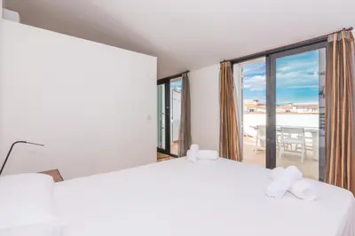Cama o camas de una habitación en HomeHolidaysRentals Escapade