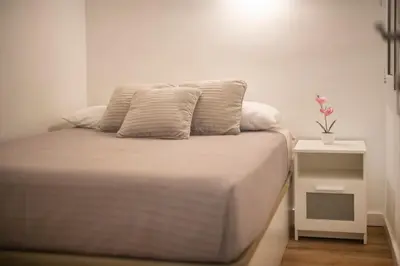 Cama o camas de una habitación en Apartamento a 100 metros de la playa
