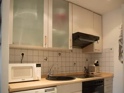 Una cocina o zona de cocina en Catalunya Apartament per 4 persones en edifici del passeig marítim amb vistes sobre la Vall d'Aro