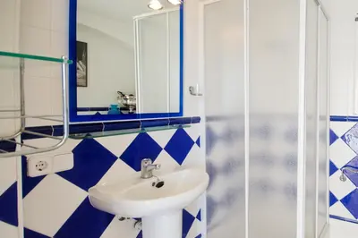 Un baño de Patio de los Gatos