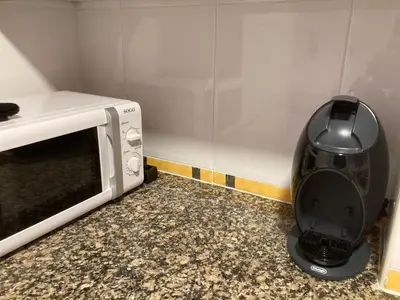 Una cocina o zona de cocina en CENTRICO y ACOGEDOR APARTAMENTO