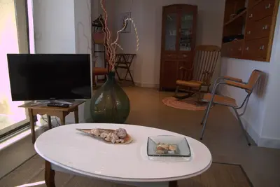 Una televisión o centro de entretenimiento en LLOGUER30 Bel's Home Bed&breakfast