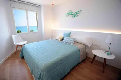 Cama o camas de una habitación en Apartamento frente al mar