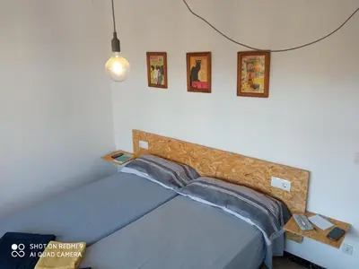 Cama o camas de una habitación en Apartament amb dues grans terrasses de 50 m2 i 16 m2 a 300 m de la platja