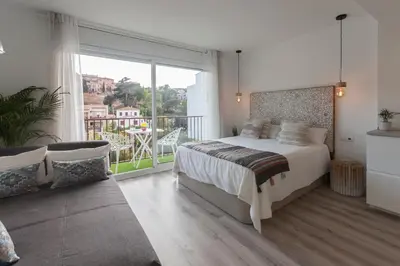 Cama o camas de una habitación en Lets Holidays AMAZING STUDIO in the CENTER of TOSSA