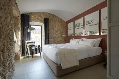 Cama o camas de una habitación en Llimona Suites - Adults Only