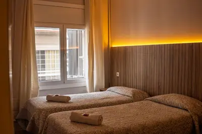 Cama o camas de una habitación en Can Setmanes by CozyCatalonia - Hostal Central Blanes
