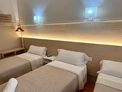 Cama o camas de una habitación en Can Setmanes by CozyCatalonia - Hostal Central Blanes