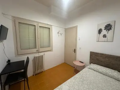 Cama o camas de una habitación en Can Setmanes by CozyCatalonia - Hostal Central Blanes