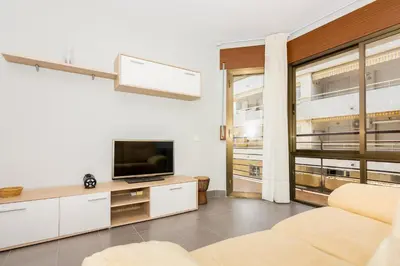 Una televisión o centro de entretenimiento en HomeHolidaysRentals Frida