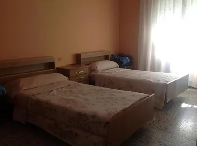 Cama o camas de una habitación en Hostel Alhambra