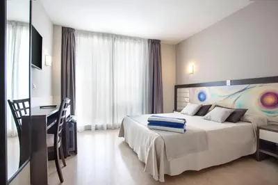 Cama o camas de una habitación en Hotel Indalo Park