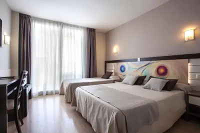 Cama o camas de una habitación en Hotel Indalo Park