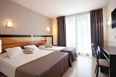 Cama o camas de una habitación en Hotel Indalo Park