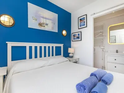 Cama o camas de una habitación en Apartment Cala Salionc by Interhome
