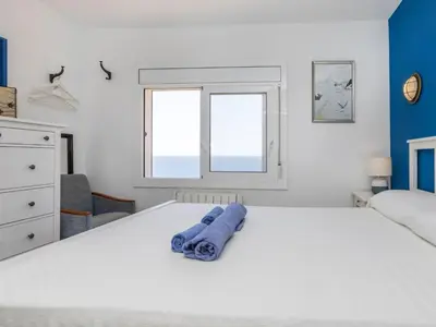 Cama o camas de una habitación en Apartment Cala Salionc by Interhome
