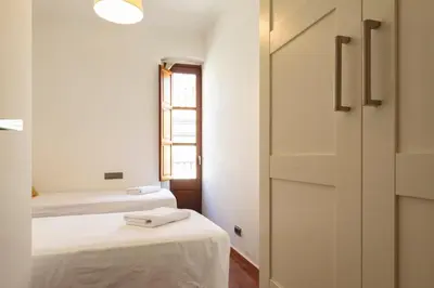 Cama o camas de una habitación en Bravissimo Mercaders 6