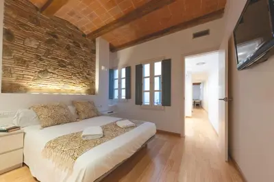 Cama o camas de una habitación en Bravissimo Plaça dels Raïms