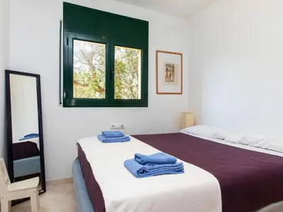 Cama o camas de una habitación en Holiday Home Mas Pere by Interhome