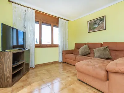 Una televisión o centro de entretenimiento en Holiday Home Can Cals by Interhome