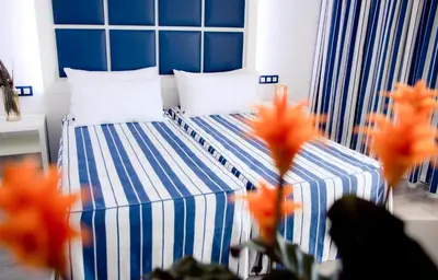 Cama o camas de una habitación en ALEGRIA Sun Village