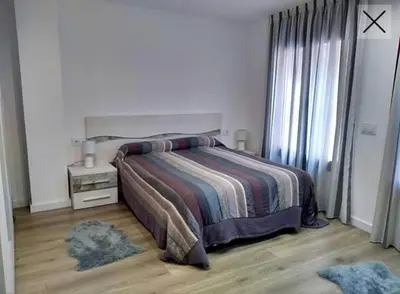 Cama o camas de una habitación en Apartamento totalmente reformado en 1ª linea