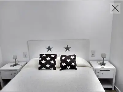 Cama o camas de una habitación en Apartamento totalmente reformado en 1ª linea