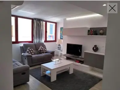 Zona de estar de Apartamento totalmente reformado en 1ª linea