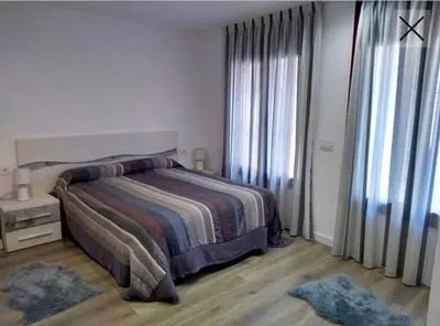 Cama o camas de una habitación en Apartamento totalmente reformado en 1ª linea