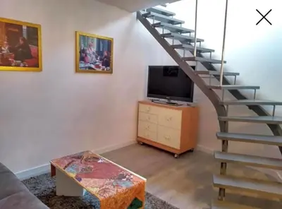 Una televisión o centro de entretenimiento en Apartamento totalmente reformado en 1ª linea