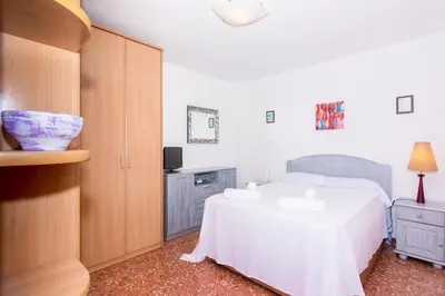 Cama o camas de una habitación en HomeHolidaysRentals Keyla