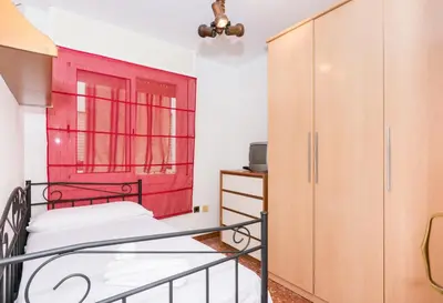 Cama o camas de una habitación en HomeHolidaysRentals Keyla