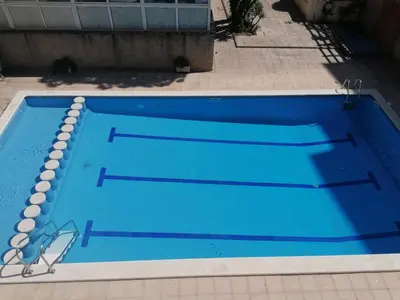 Piscina en o cerca de APARTAMENTO CON WIFI Y PISCINA EN BLANES FRENTE A LA PLAYA - Costa Brava