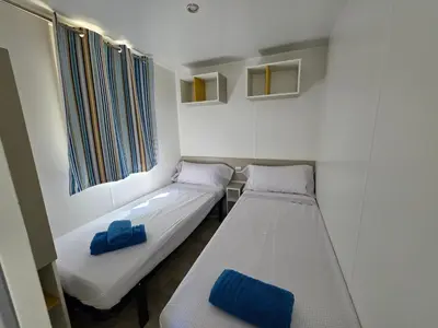 Cama o camas de una habitación en El Carlitos