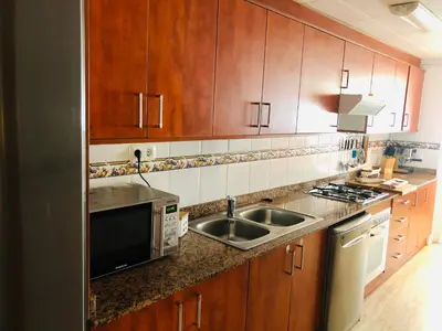 Una cocina o zona de cocina en Apartamento con terraza y piscina en Malgrat de Mar