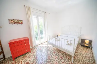 Cama o camas de una habitación en HomeHolidaysRentals Arlene