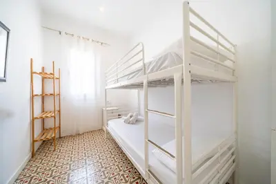 Cama o camas de una habitación en HomeHolidaysRentals Arlene