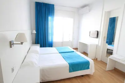 Cama o camas de una habitación en Hotel Villa Garbí