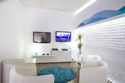 Una televisión o centro de entretenimiento en Hotel Villa Garbí